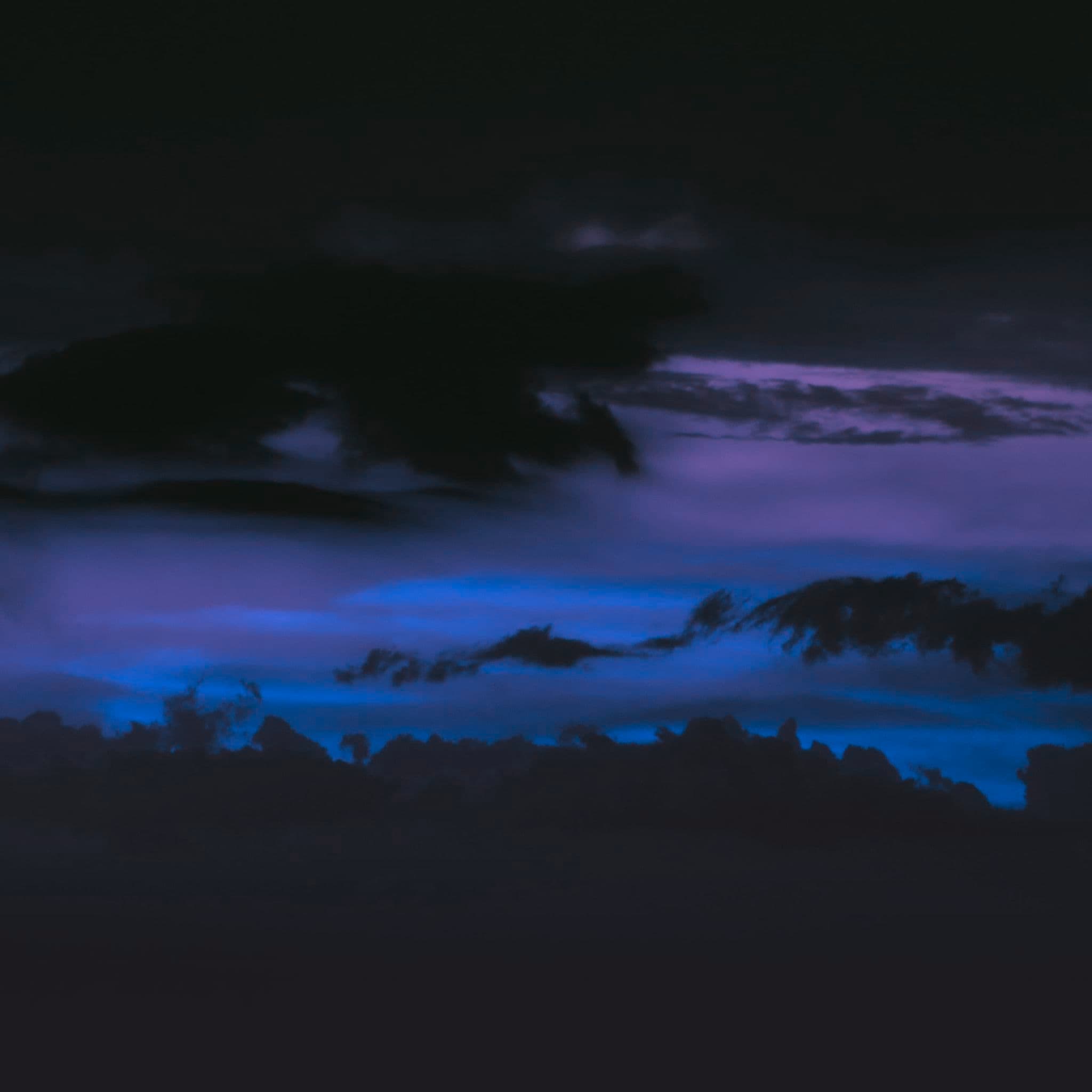 a picture i took of a sunset, but hue-shifted to be blue and purple