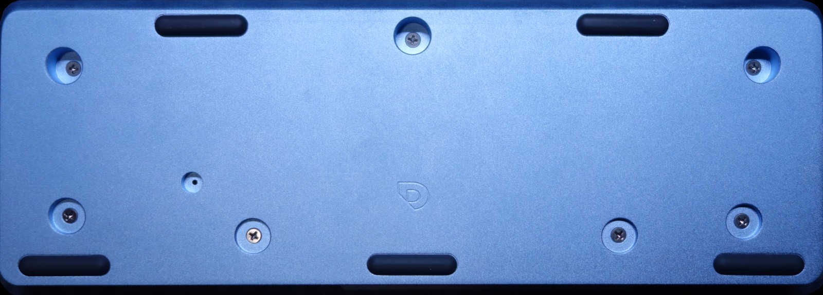 Bottom view (light blue, various screw holes, and an engraved Drop logo)