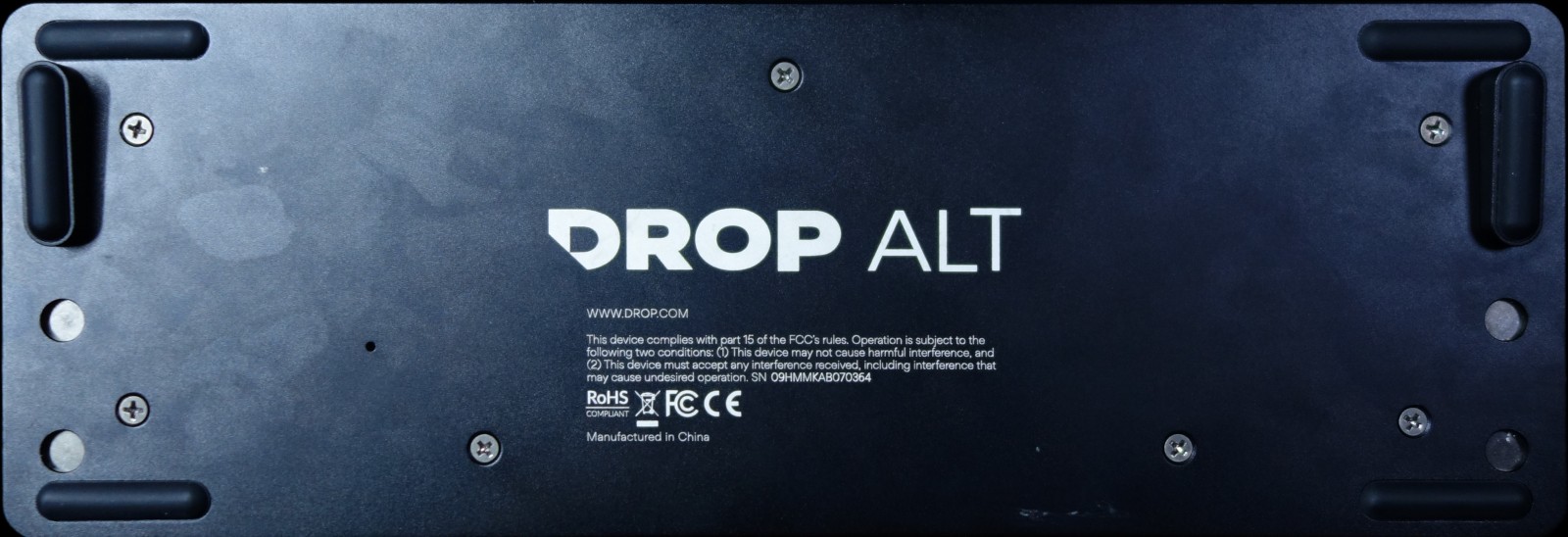 Bottom view (black, various flush screws visible, magnetic feet attached, DROP ALT wordmark)