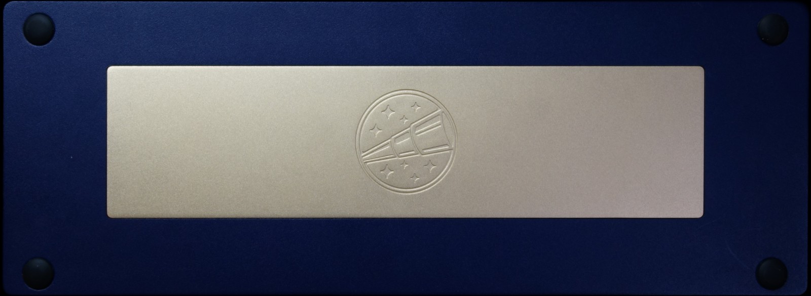 Bottom view (navy blue, with copper plate engraved with a telescope logo)